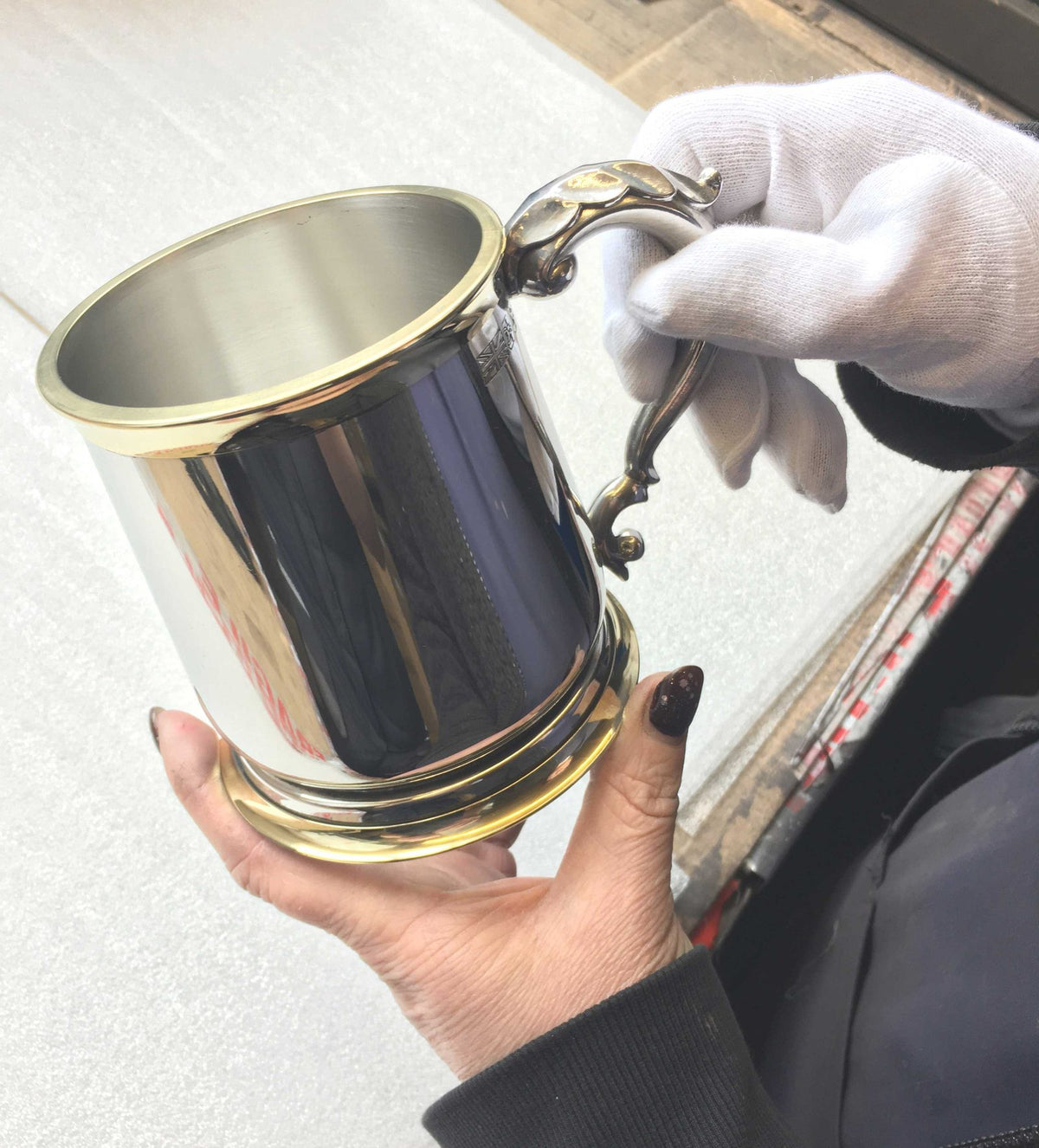 A finished pewter tankard being inspected by hand at the Edwin Blyde workshop